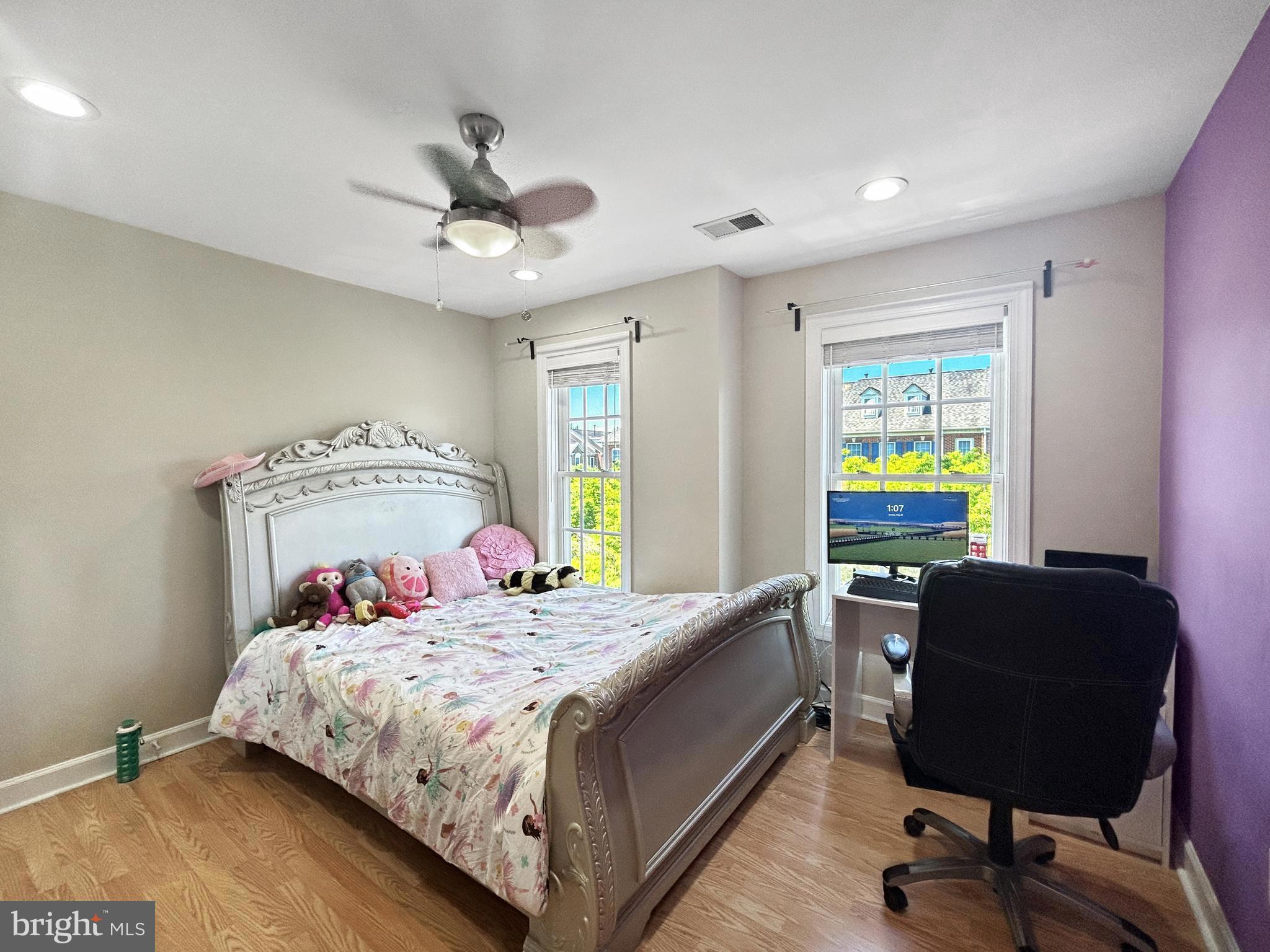 913 Highland Ridge Avenue Gaithersburg, MD 20878 - Photo 15 of 38 a bedroom with a bed and a chandelier