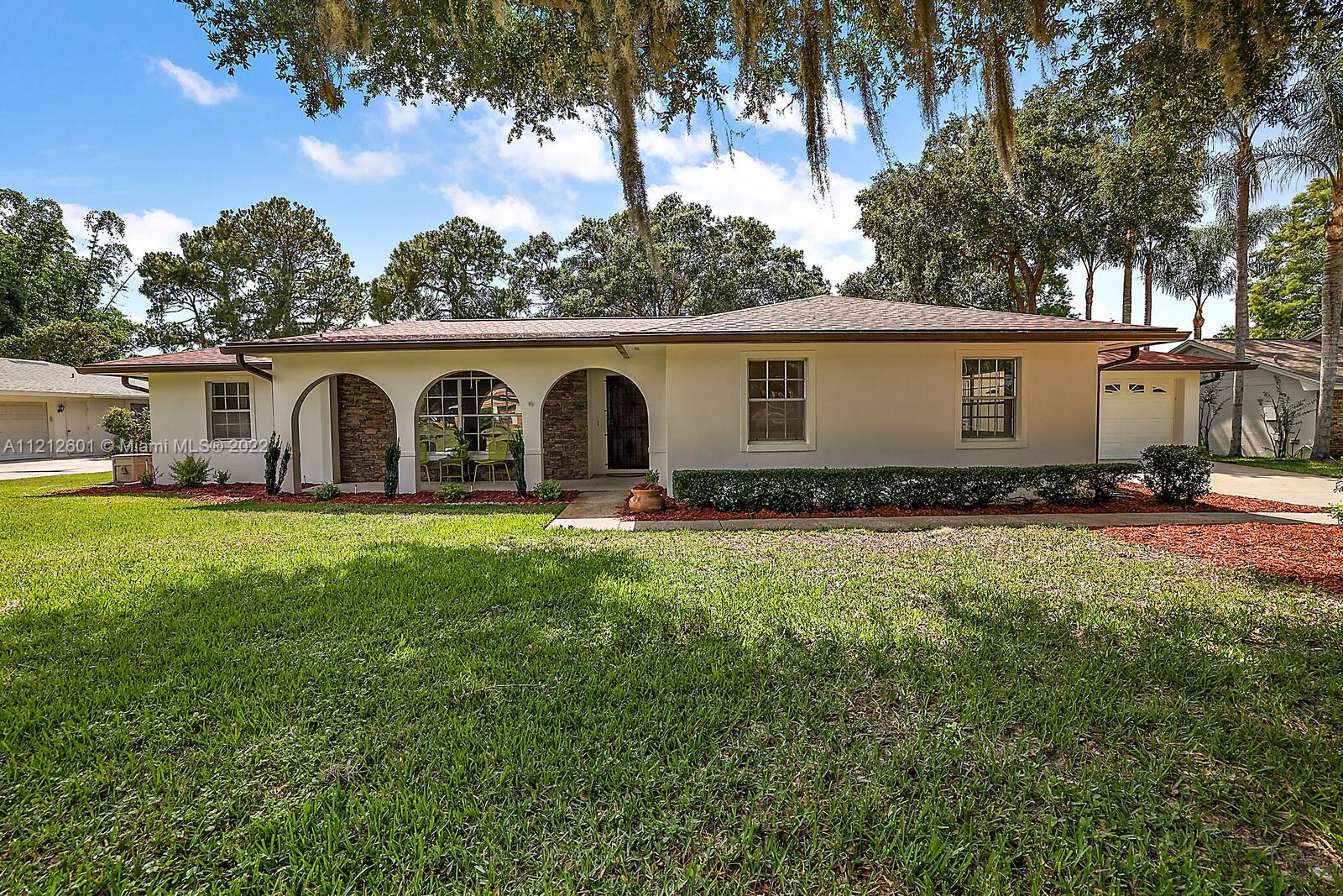 a front view of a house with yard