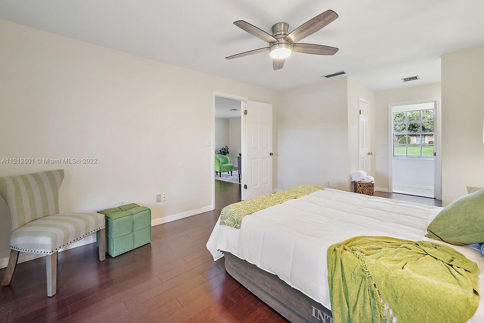 3052 Pine Cove Place Eustis, FL 32726 - Photo 15 of 32 a bedroom with a bed and window