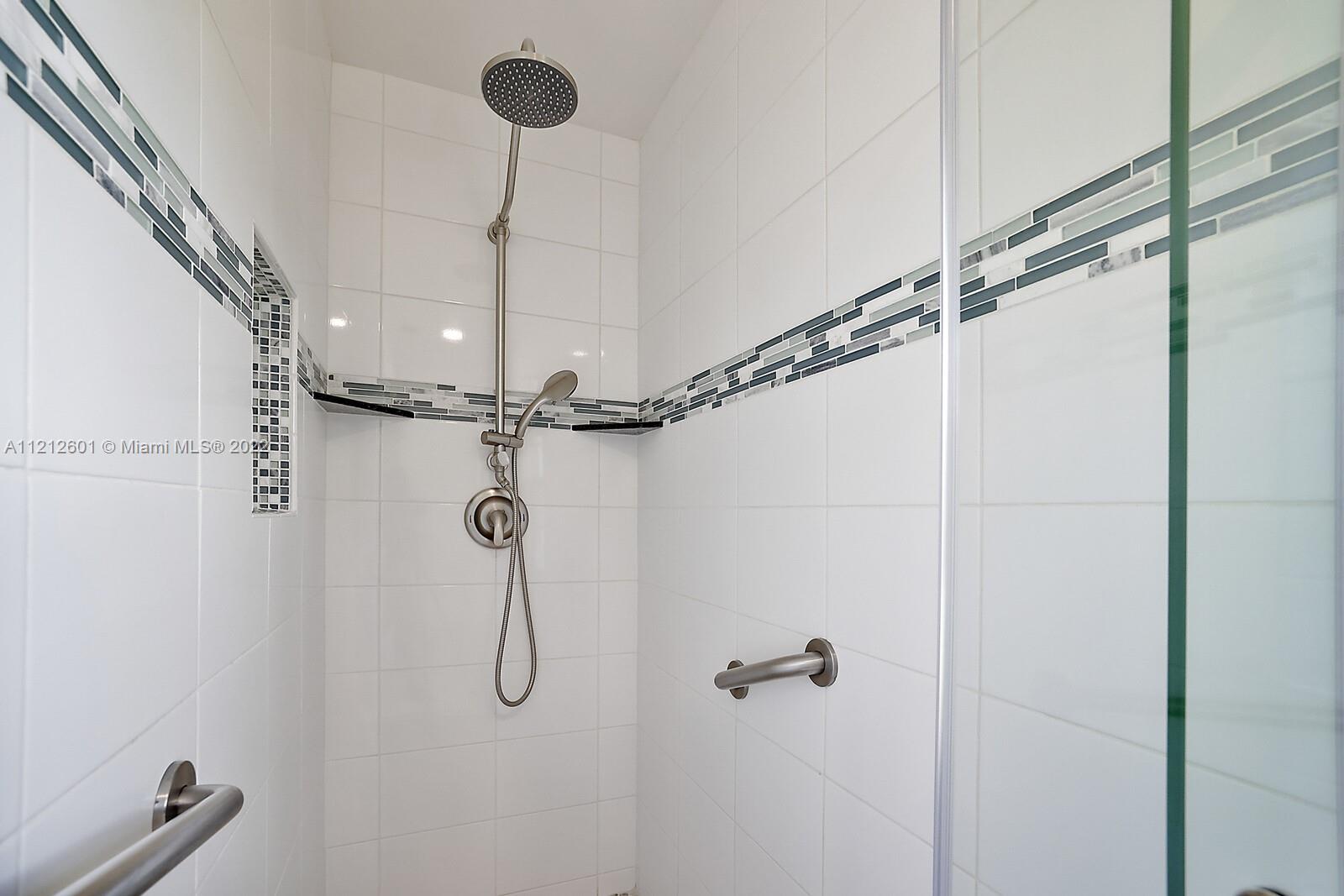 3052 Pine Cove Place Eustis, FL 32726 - Photo 17 of 32 a bathroom with a shower