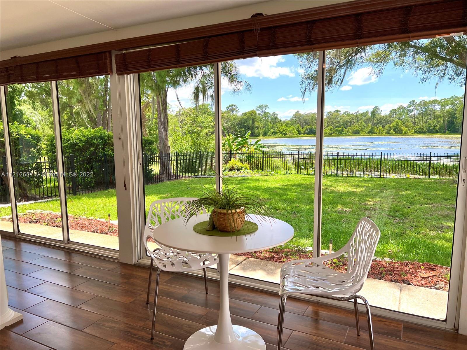 3052 Pine Cove Place Eustis, FL 32726 - Photo 19 of 32 a view of a room with a patio