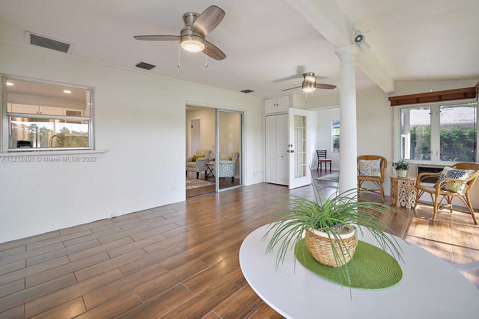 3052 Pine Cove Place Eustis, FL 32726 - Photo 20 of 32 a living room with furniture kitchen and a window