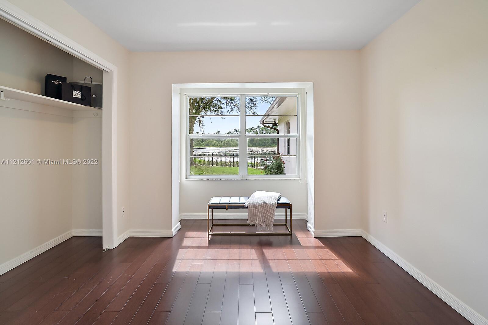 3052 Pine Cove Place Eustis, FL 32726 - Photo 21 of 32 a living room with furniture and a window