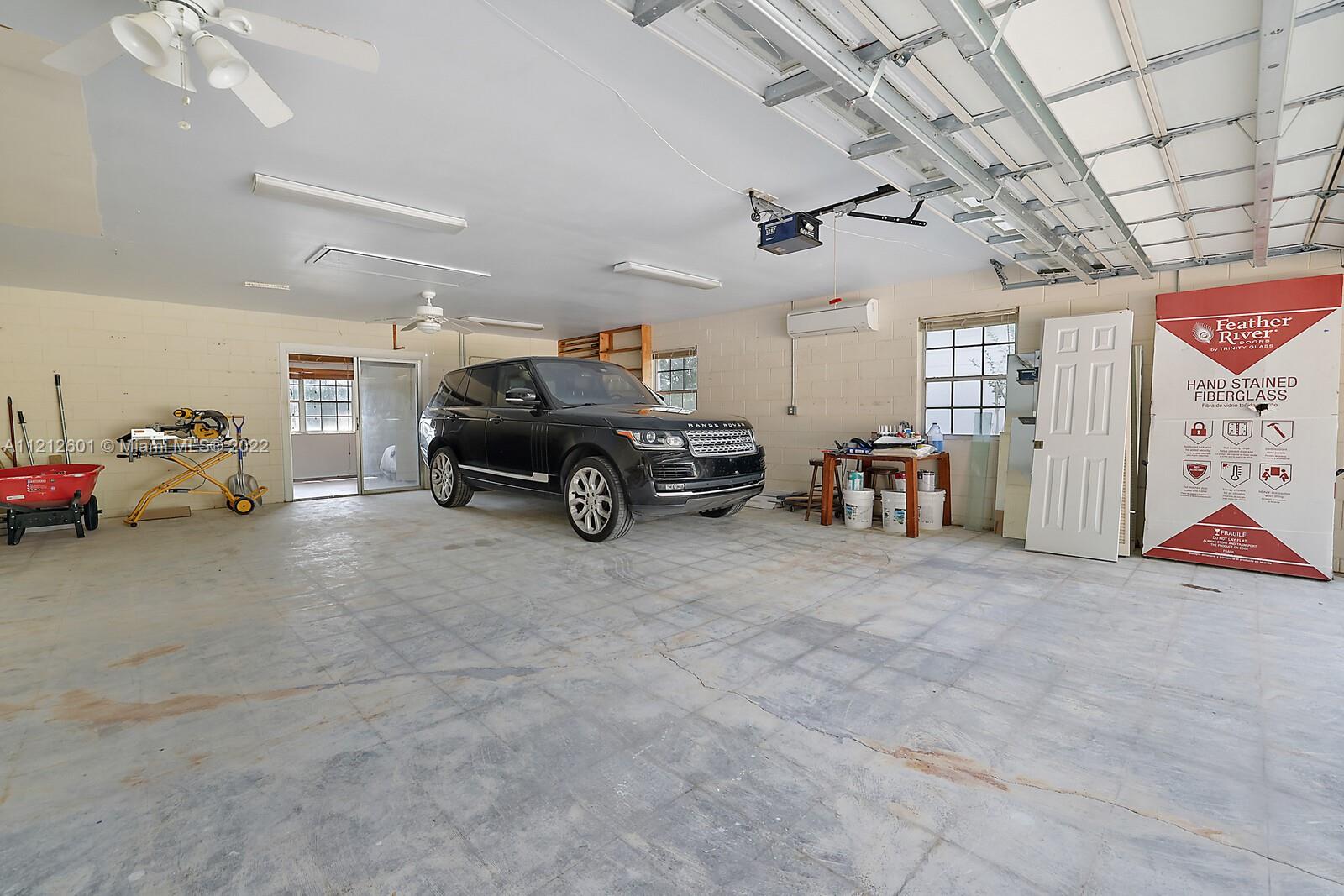 3052 Pine Cove Place Eustis, FL 32726 - Photo 26 of 32 a car parked in garage of a garage