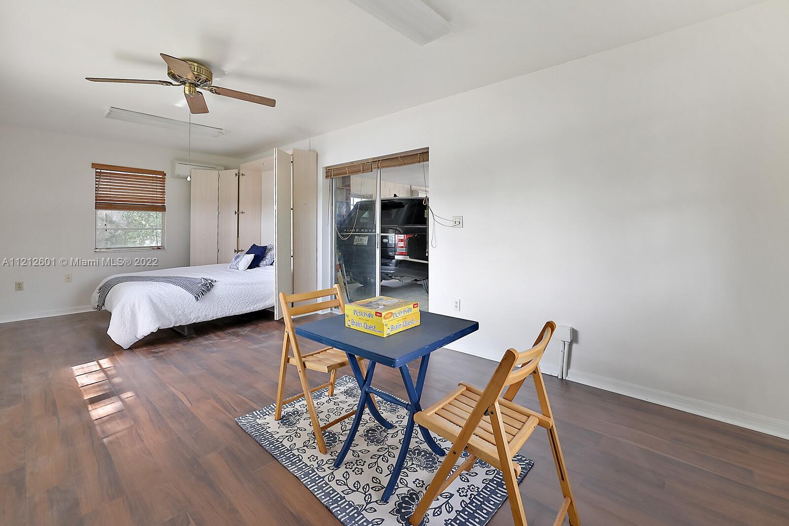 3052 Pine Cove Place Eustis, FL 32726 - Photo 27 of 32 a living room with furniture and a table
