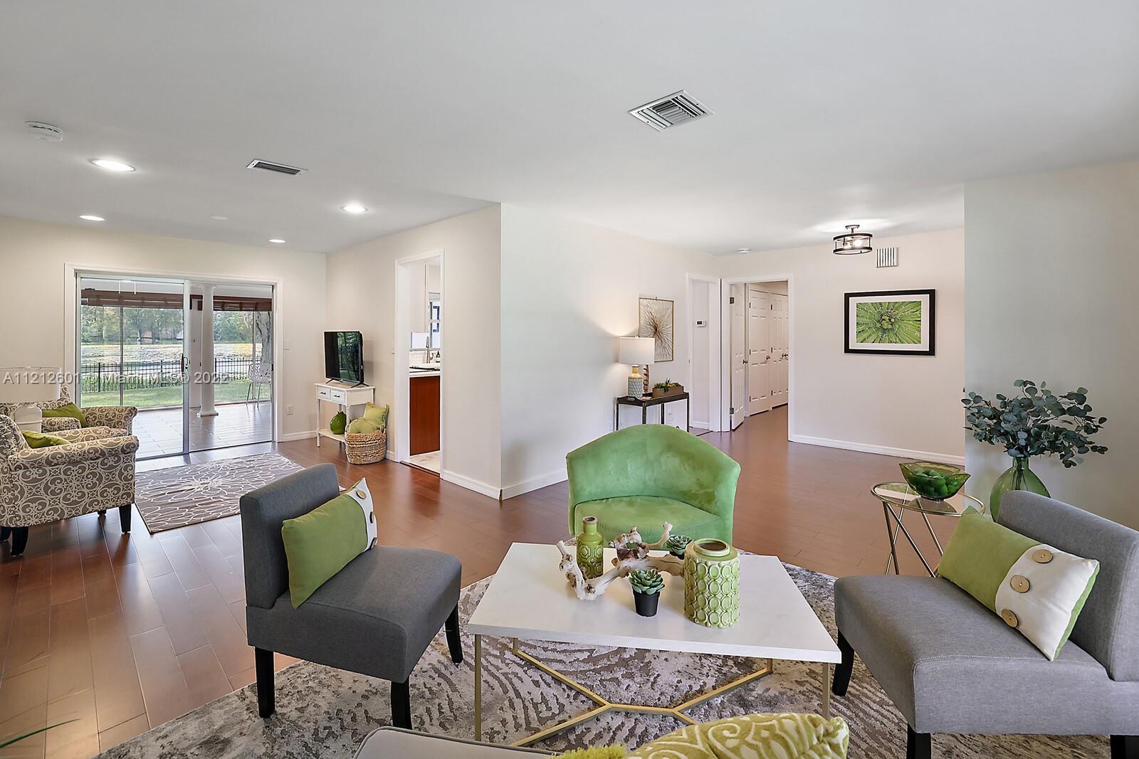 3052 Pine Cove Place Eustis, FL 32726 - Photo 5 of 32 a living room with furniture and wooden floor