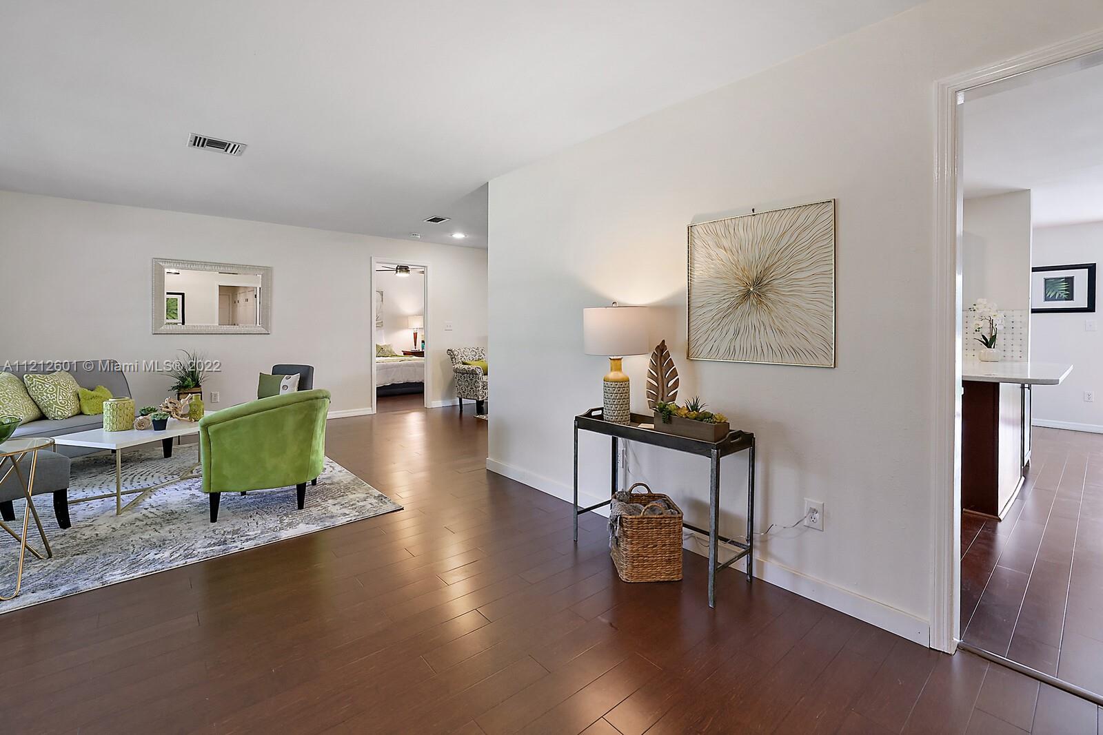 3052 Pine Cove Place Eustis, FL 32726 - Photo 7 of 32 a living room with furniture and a wooden floor