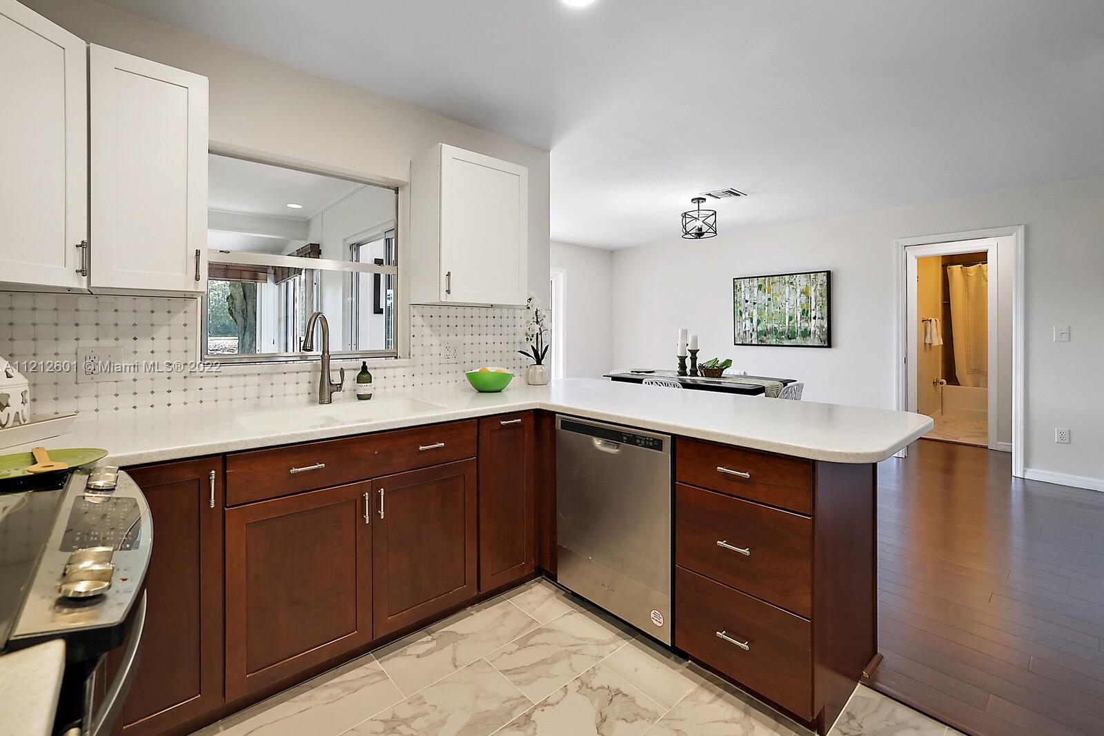 3052 Pine Cove Place Eustis, FL 32726 - Photo 9 of 32 a kitchen with a sink and cabinets
