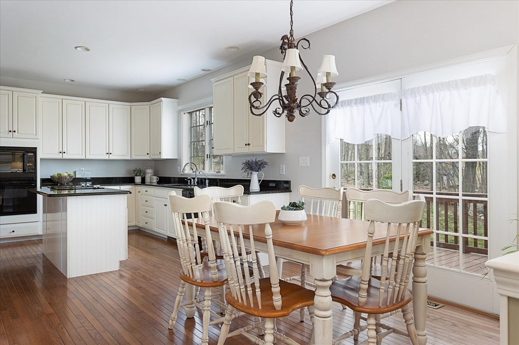 16 Carter Road Shrewsbury, MA 01545 - Photo 11 of 42 a view of a dining room with furniture wooden floor and chandelier