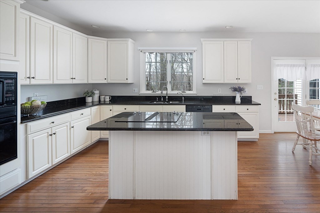 16 Carter Road Shrewsbury, MA 01545 - Photo 13 of 42 a kitchen with granite countertop a sink stove and cabinets
