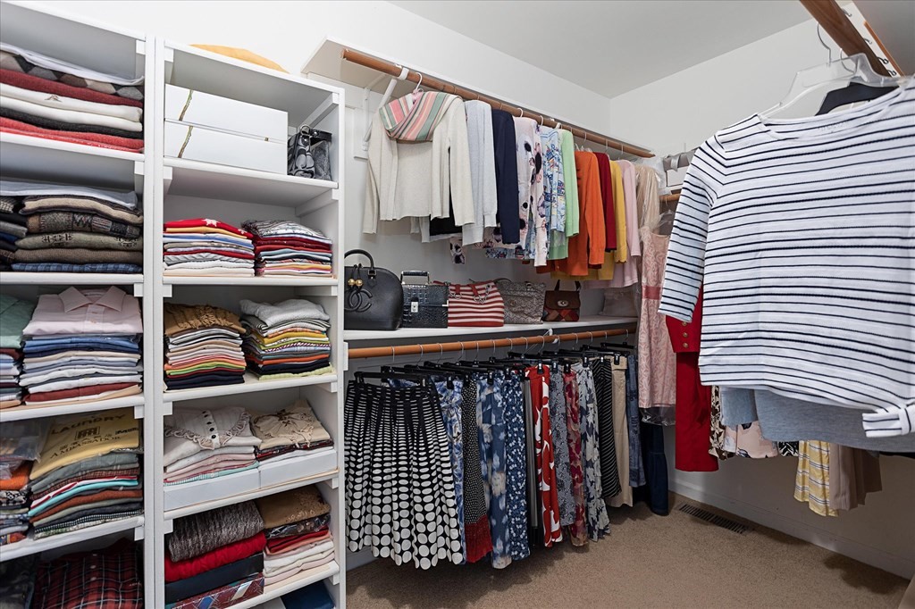 16 Carter Road Shrewsbury, MA 01545 - Photo 27 of 42 a view of walk in closet with clothes and shoes