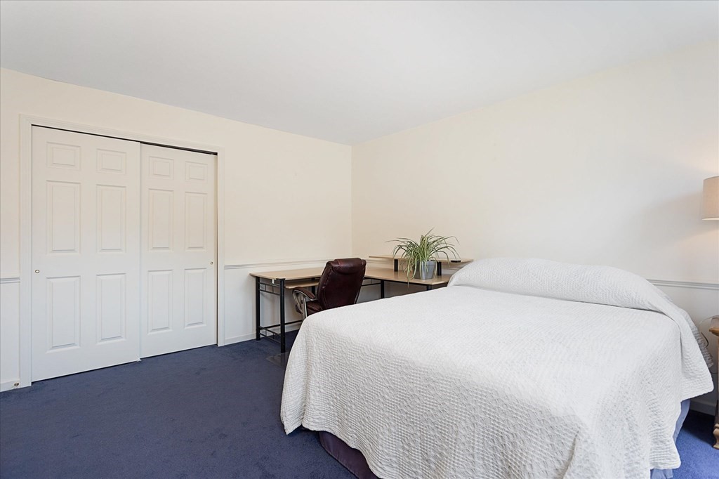 16 Carter Road Shrewsbury, MA 01545 - Photo 33 of 42 a bedroom with a bed and a table