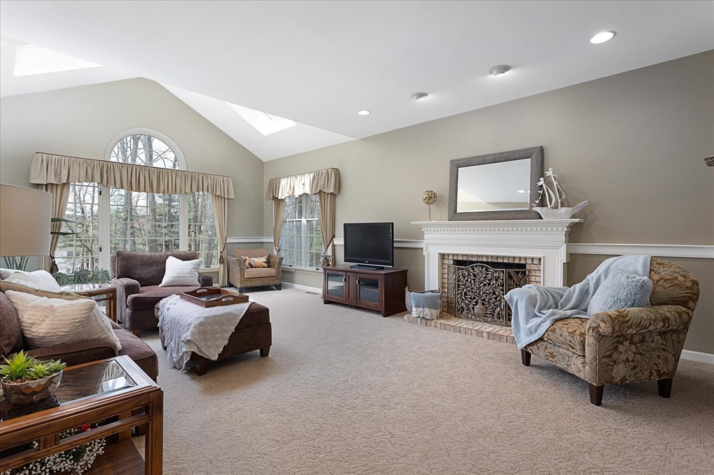 16 Carter Road Shrewsbury, MA 01545 - Photo 9 of 42 a living room with furniture and a fireplace