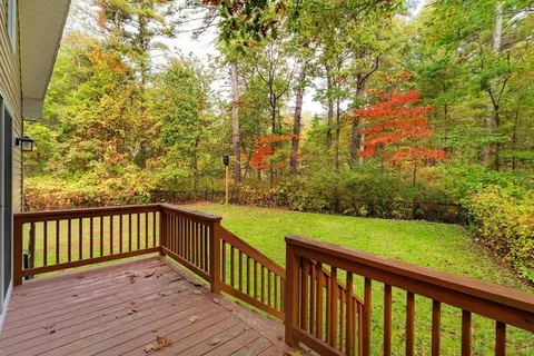 a view of deck with wooden floor and fence