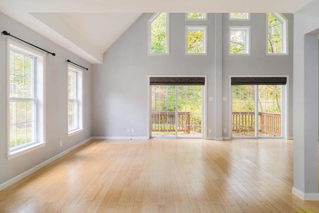 267 Carlisle Road Bedford, MA 01730 - Photo 20 of 32 a view of an empty room with large windows