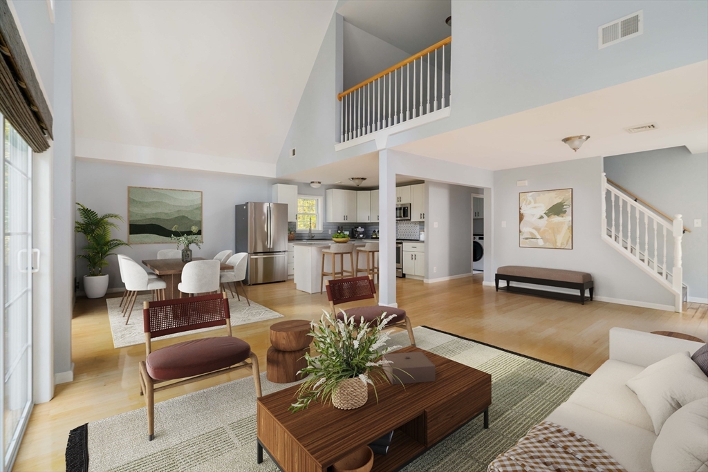 267 Carlisle Road Bedford, MA 01730 - Photo 2 of 32 a living room with furniture and a wooden floor