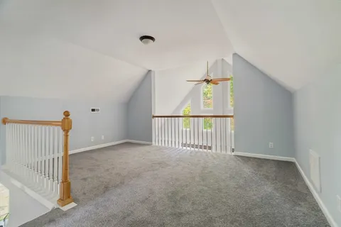 a view of a hallway with a window
