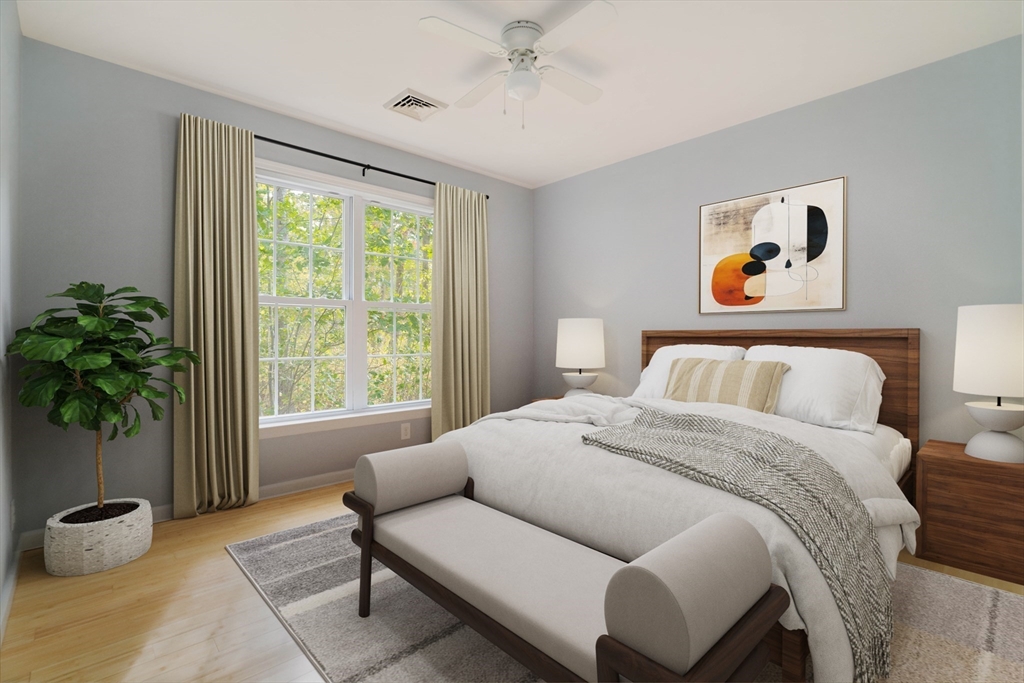 267 Carlisle Road Bedford, MA 01730 - Photo 7 of 32 a bedroom with a bed and a potted plant