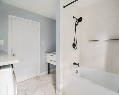 a bathroom with a bath tub
