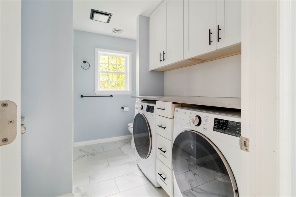 267 Carlisle Road Bedford, MA 01730 - Photo 10 of 32 a utility room with dryer and washer