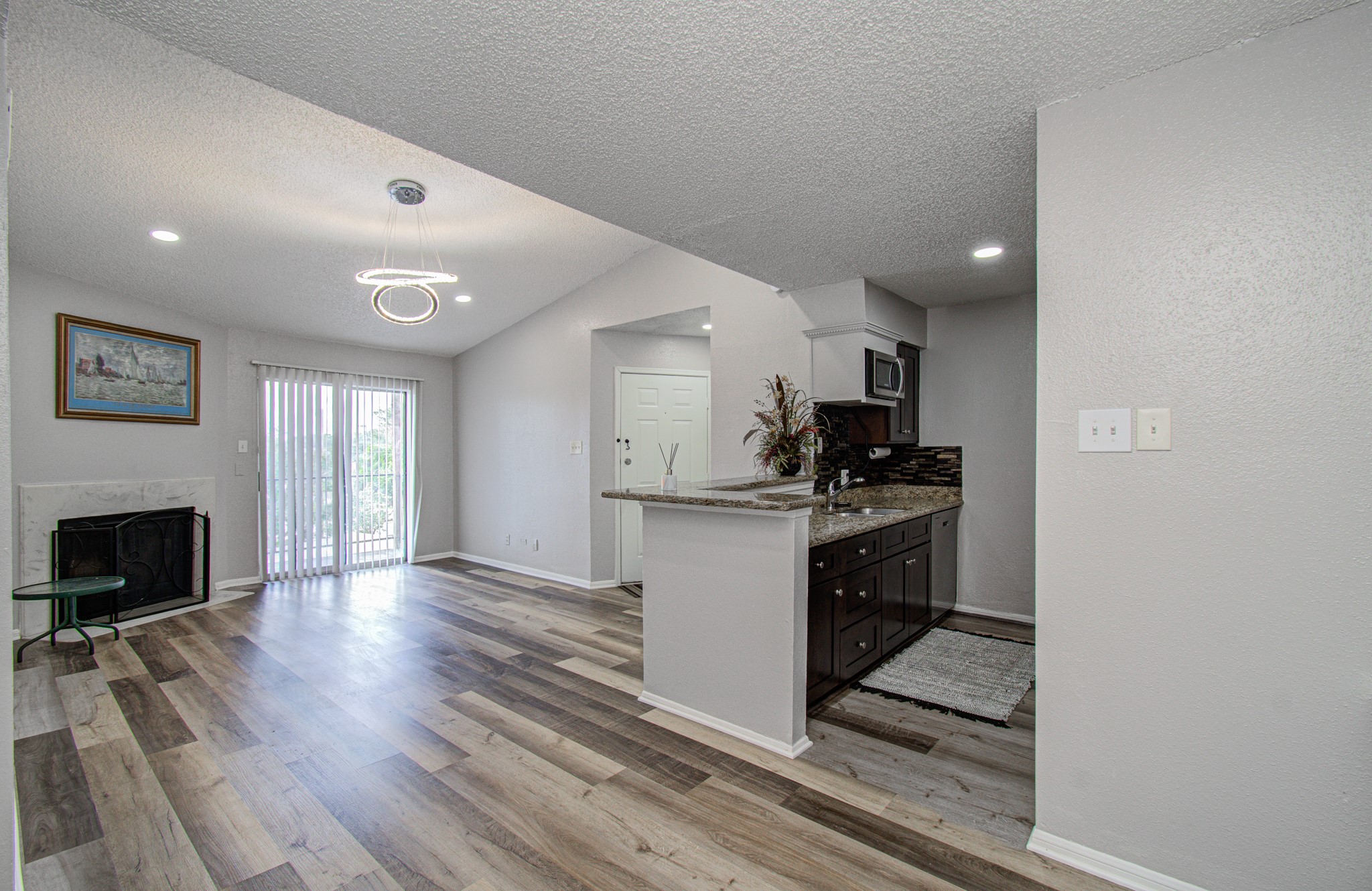 10101 South Gessner Road, Unit 405 Houston, TX 77071 - Photo 1 of 27 a kitchen with granite countertop a stove top oven and cabinets