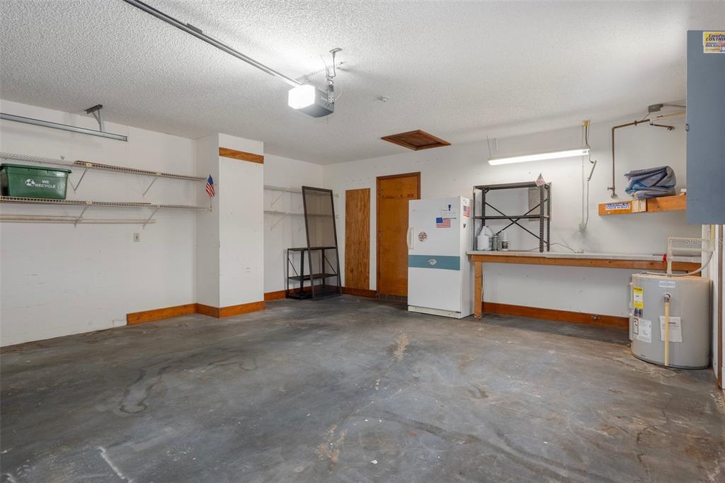 8332 Berkeley Manor Boulevard Spring Hill, FL 34606 - Photo 13 of 45 a view of a livingroom with furniture and a kitchen