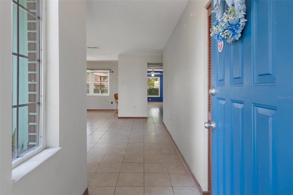 8332 Berkeley Manor Boulevard Spring Hill, FL 34606 - Photo 15 of 45 wooden floor in an empty room with a window