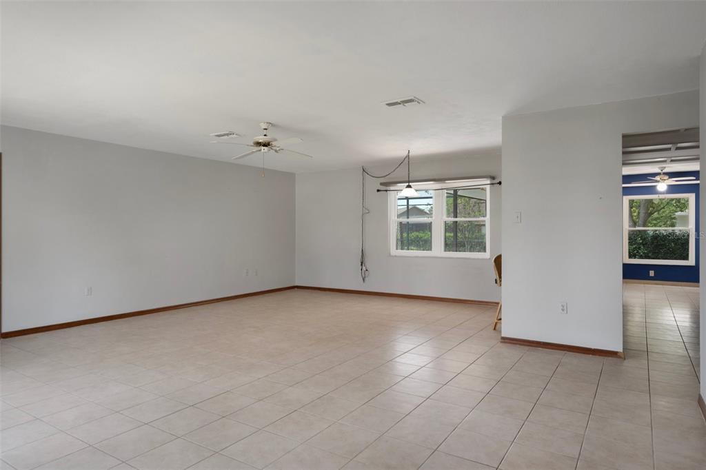 8332 Berkeley Manor Boulevard Spring Hill, FL 34606 - Photo 16 of 45 an empty room with windows