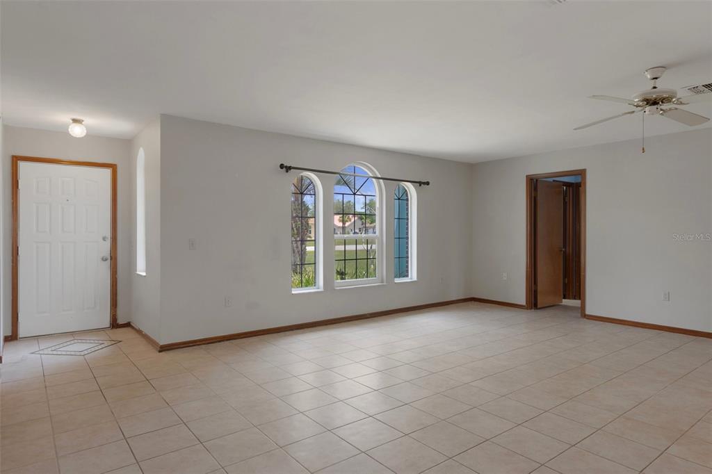 8332 Berkeley Manor Boulevard Spring Hill, FL 34606 - Photo 19 of 45 an empty room with windows