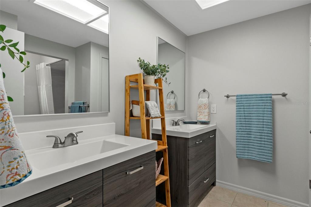 8332 Berkeley Manor Boulevard Spring Hill, FL 34606 - Photo 19 of 47 a bathroom with a sink double vanity and a mirror