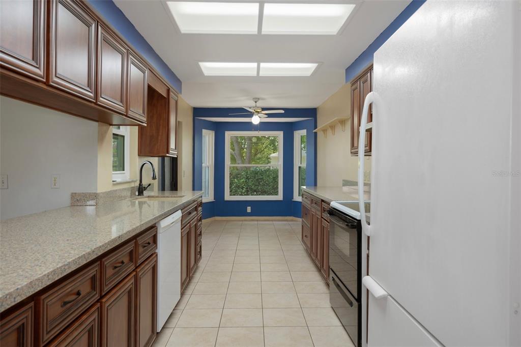 8332 Berkeley Manor Boulevard Spring Hill, FL 34606 - Photo 21 of 45 a kitchen with a sink and a window