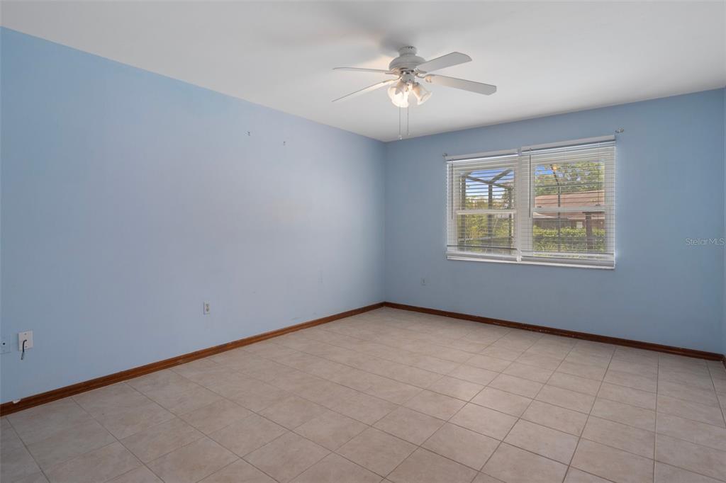 8332 Berkeley Manor Boulevard Spring Hill, FL 34606 - Photo 24 of 45 an empty room with windows