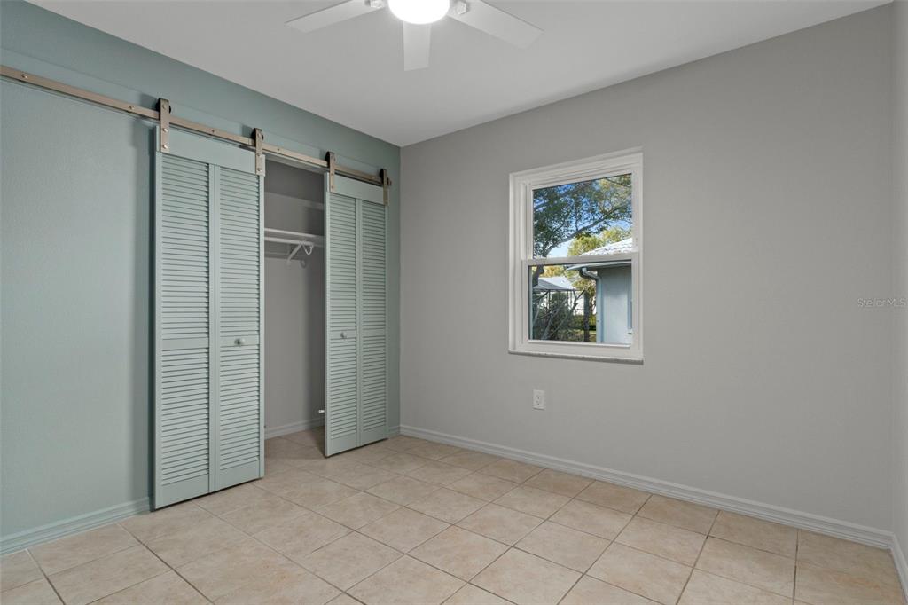 8332 Berkeley Manor Boulevard Spring Hill, FL 34606 - Photo 25 of 47 a view of an empty room with a window