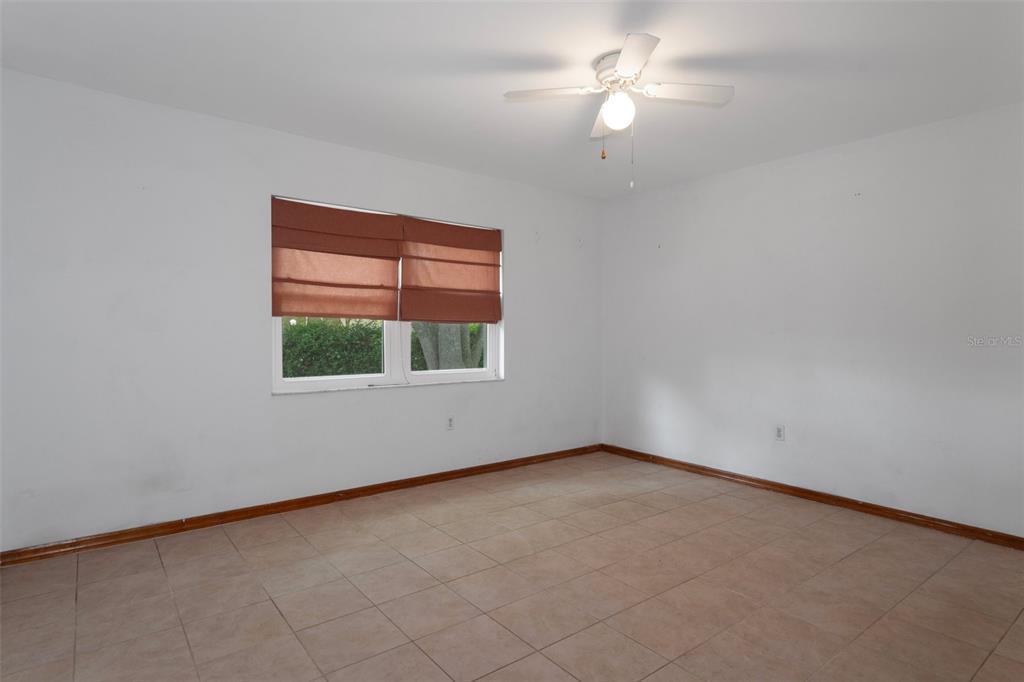 8332 Berkeley Manor Boulevard Spring Hill, FL 34606 - Photo 29 of 45 an empty room with a window
