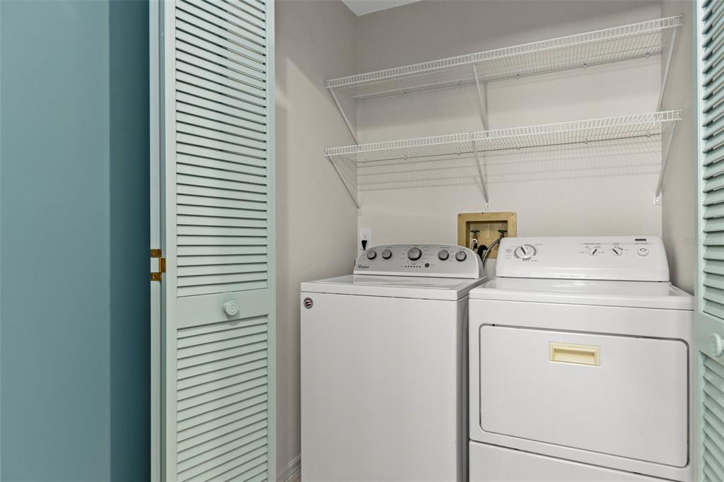 8332 Berkeley Manor Boulevard Spring Hill, FL 34606 - Photo 29 of 47 a utility room with dryer and washer