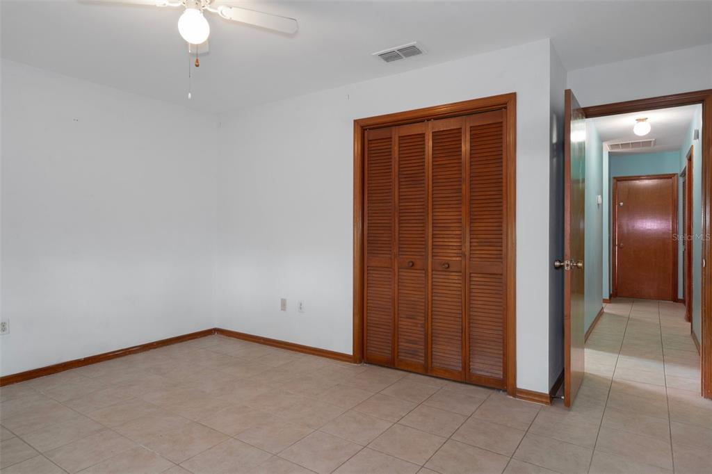 8332 Berkeley Manor Boulevard Spring Hill, FL 34606 - Photo 31 of 45 an empty room with closet area