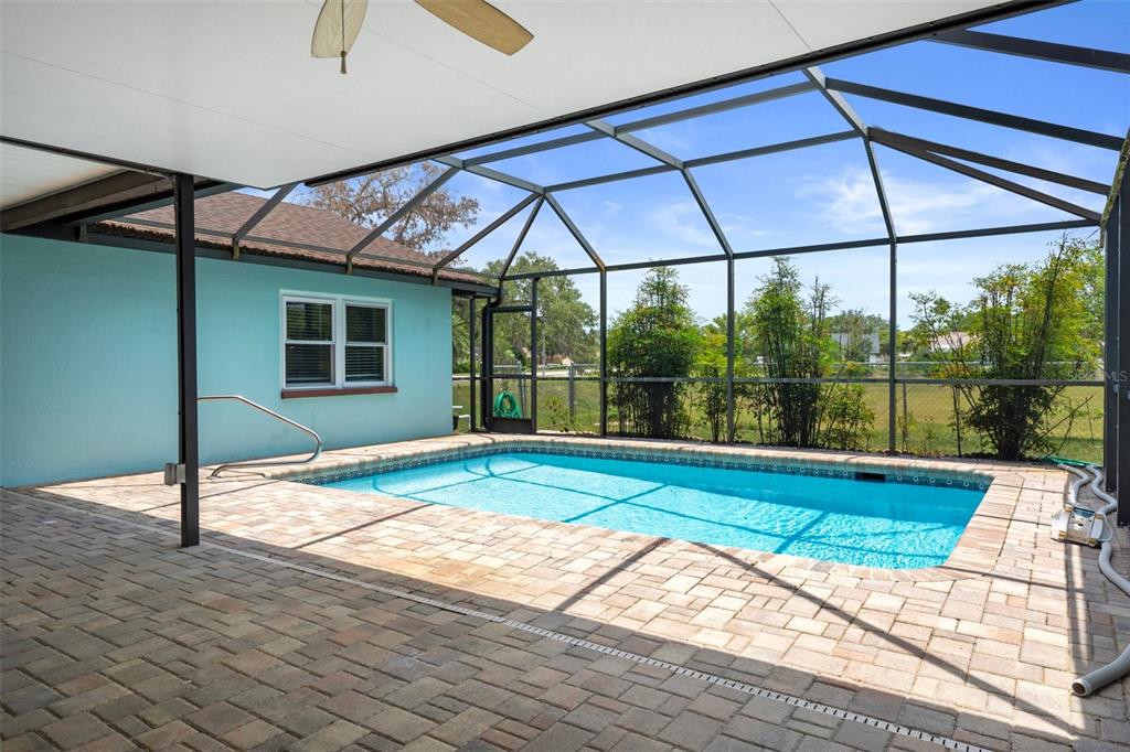 8332 Berkeley Manor Boulevard Spring Hill, FL 34606 - Photo 33 of 47 a room that has a bed and a large window