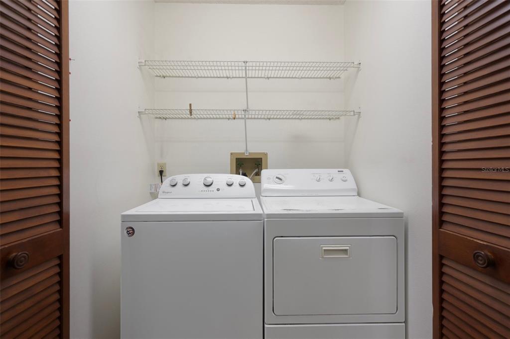 8332 Berkeley Manor Boulevard Spring Hill, FL 34606 - Photo 36 of 45 a utility room with dryer and washer
