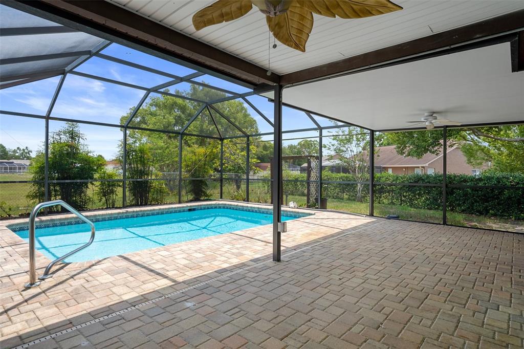 8332 Berkeley Manor Boulevard Spring Hill, FL 34606 - Photo 38 of 45 a view of a house with a big yard