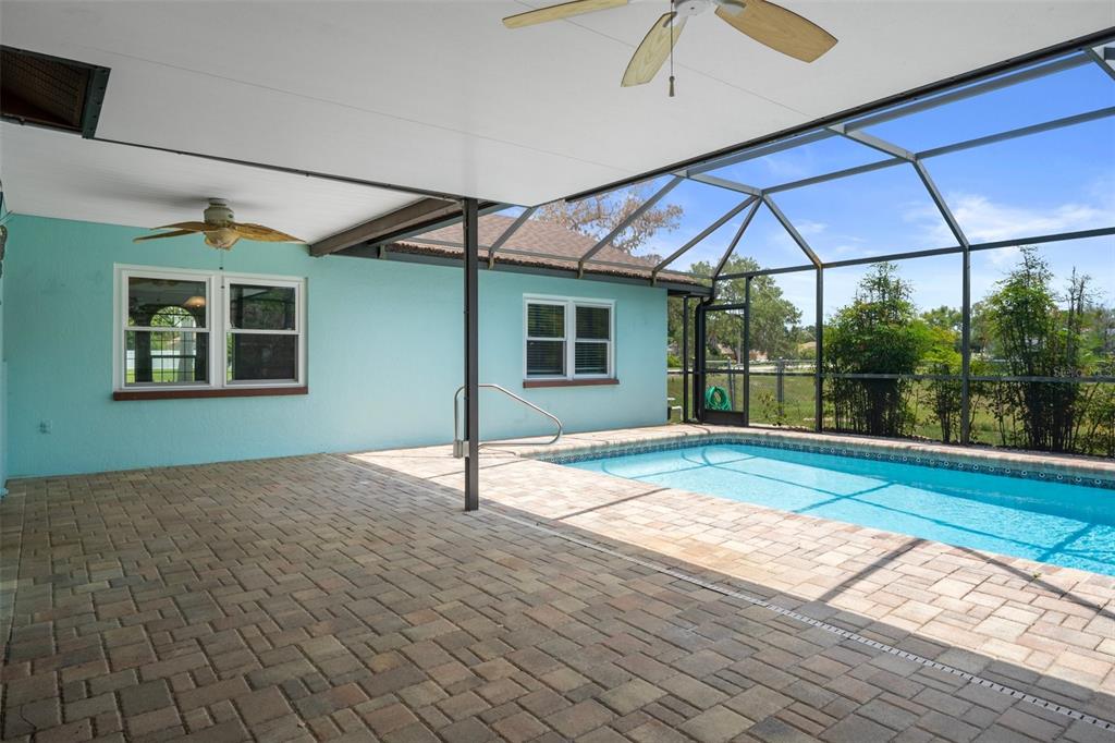 8332 Berkeley Manor Boulevard Spring Hill, FL 34606 - Photo 39 of 45 a house view with a backyard space