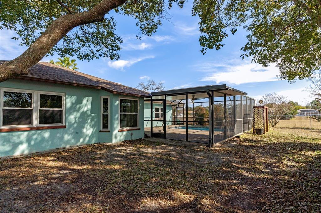 8332 Berkeley Manor Boulevard Spring Hill, FL 34606 - Photo 42 of 47 a front view of a house with a yard