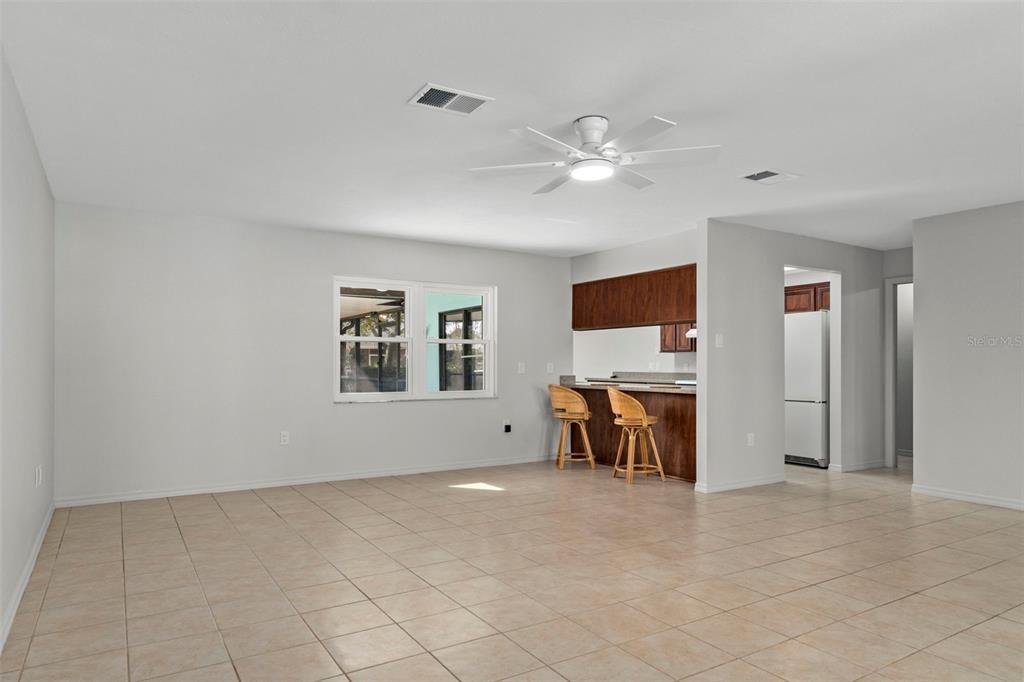 8332 Berkeley Manor Boulevard Spring Hill, FL 34606 - Photo 8 of 47 a view of livingroom with furniture and chandelier fan
