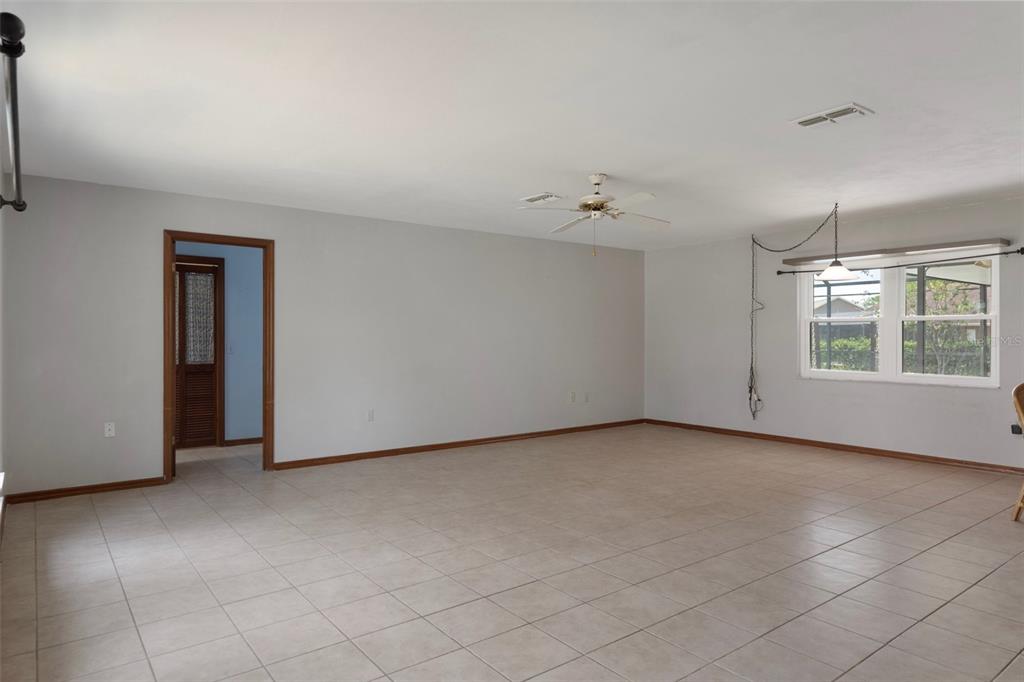 8332 Berkeley Manor Boulevard Spring Hill, FL 34606 - Photo 9 of 45 a view of an empty room with a window