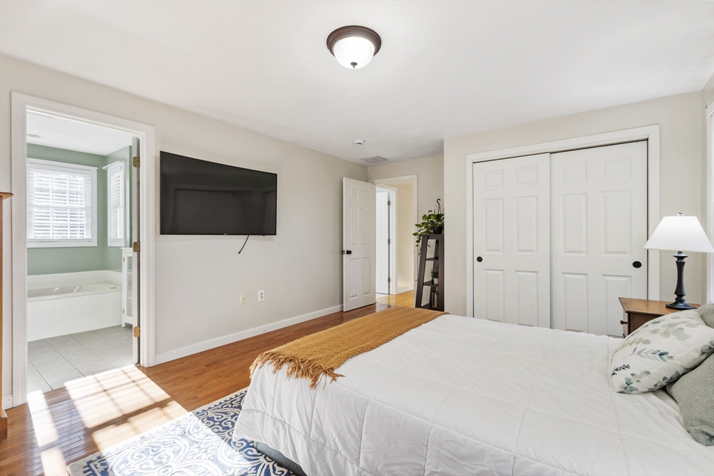 460 High Street Rochester, MA 02770 - Photo 20 of 31 a bedroom with a bed and a flat screen tv