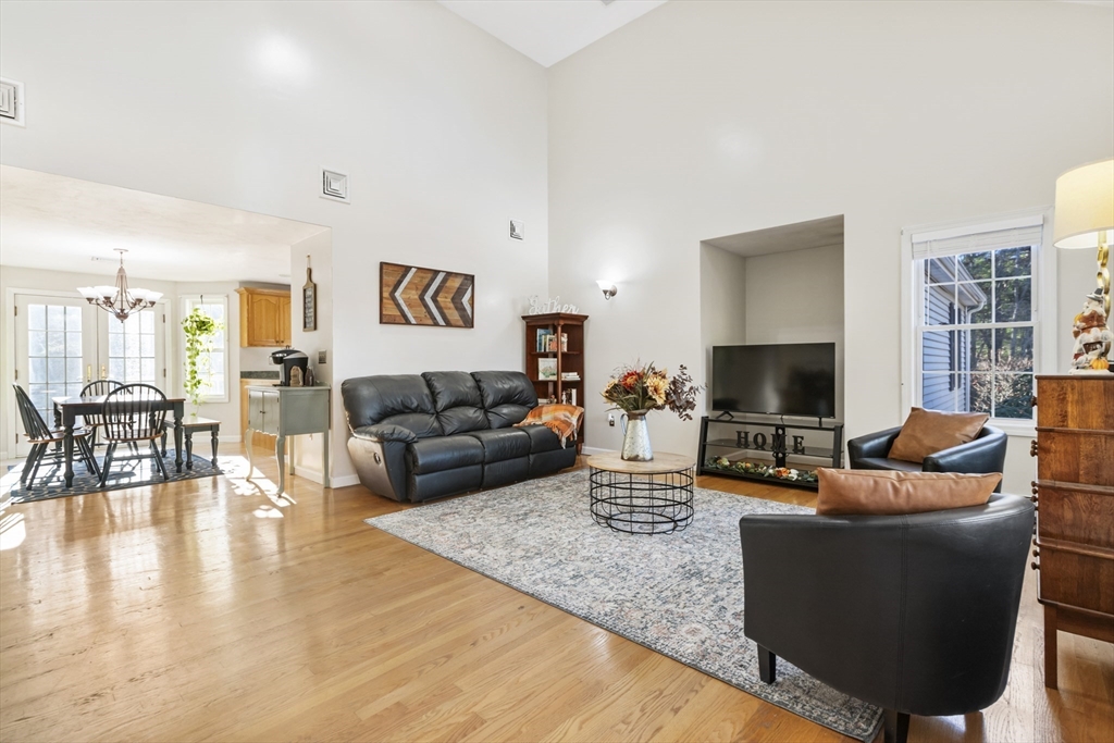 460 High Street Rochester, MA 02770 - Photo 6 of 31 a living room with furniture a flat screen tv and a large window