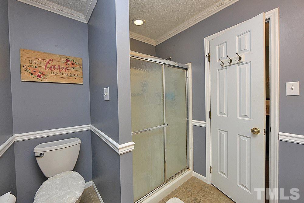 2804 Livery Way Raleigh, NC 27603 - Photo 20 of 24 a bathroom with a toilet and a shower