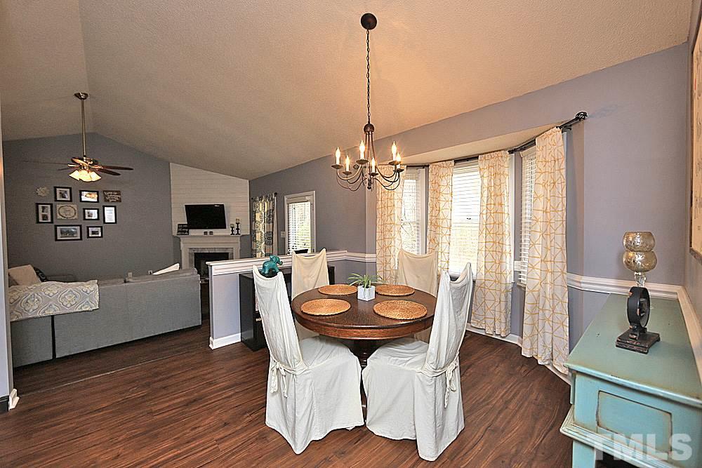 2804 Livery Way Raleigh, NC 27603 - Photo 6 of 24 a view of a dining room with furniture window and wooden floor