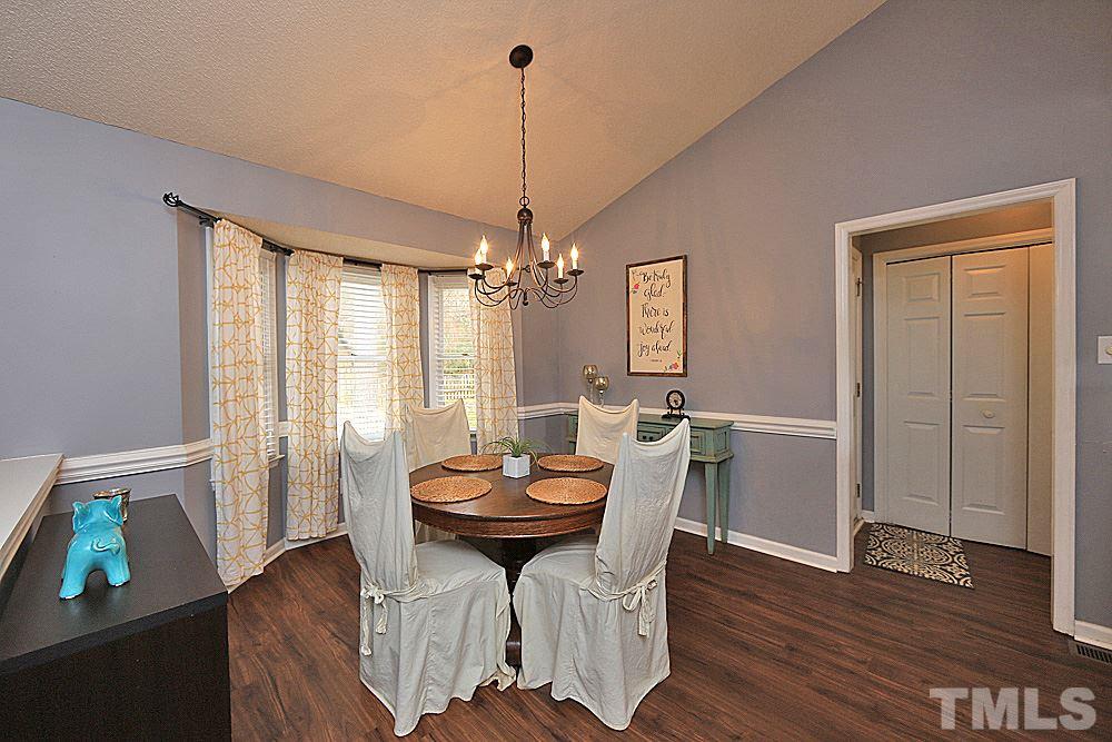 2804 Livery Way Raleigh, NC 27603 - Photo 7 of 24 a view of a dining room with furniture window and wooden floor