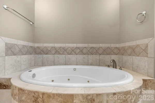 a white bath tub sitting in a bathroom