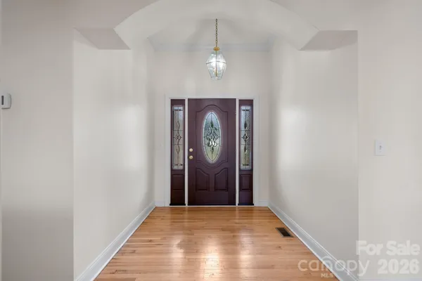a view of entryway with wooden floor